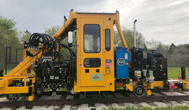 Railway maintenance, rail maintenance, railroad maintenance machines, railway equipment, maintenance of way equipment, anchor applicator, rail anchor machines, anchor squeezers, anchor spreaders, anchor remover, tie replacement machine, tie removal, rail tie equipment, railroad track maintenance, dual anchor adjuster