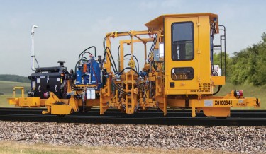 Railway maintenance, rail maintenance, railroad maintenance machines, railway equipment, maintenance of way equipment, anchor applicator, rail anchor machines, anchor squeezers, anchor spreaders, anchor remover, tie replacement machine, tie removal, rail tie equipment, railroad track maintenance,